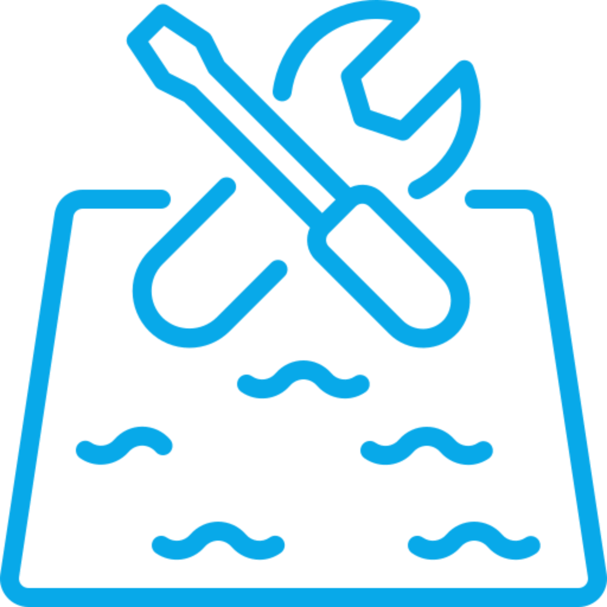 Sandbox icon with tools and waves.